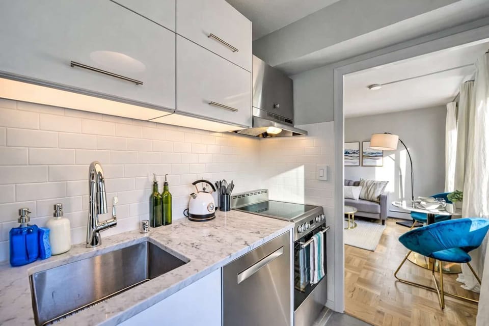 Sleek kitchen with modern appliances and an open view leading into the bright living space.