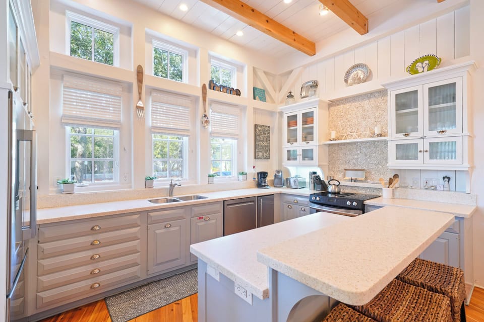 RENOVATED KITCHEN VIEW WITH BARSTOOL SEATING FOR 3