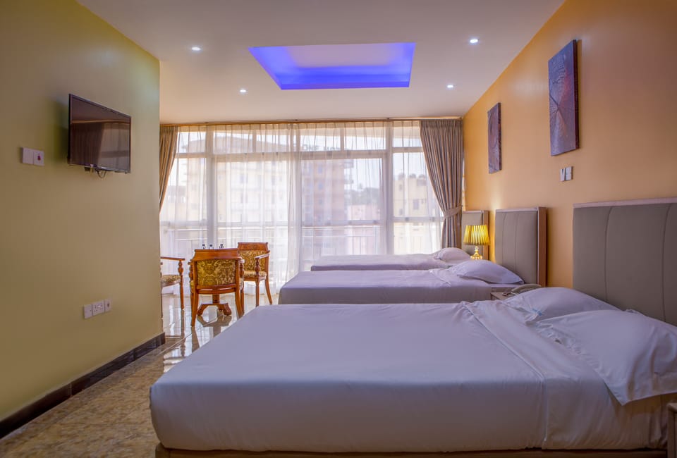 Family Room | Pillowtop beds, laptop workspace, free WiFi, bed sheets