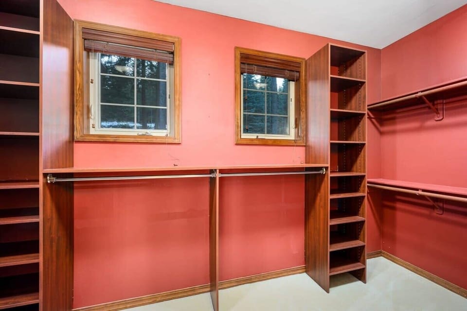 Your spacious walk-in closet offers abundant storage with custom wood shelving and hanging rods to keep all your belongings perfectly organized.