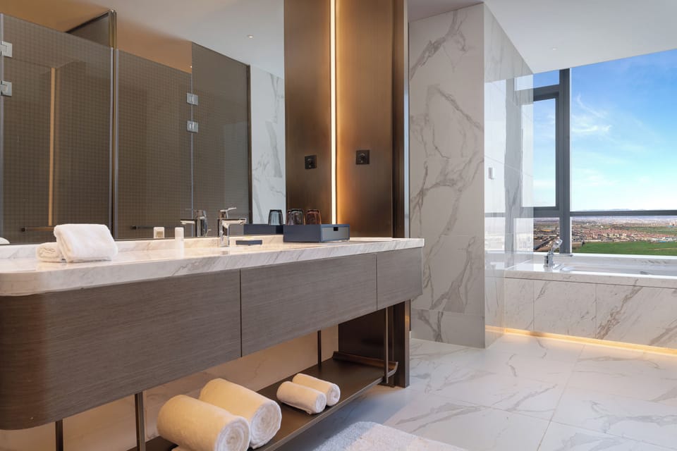 Junior Suite, 1 King Bed | Bathroom | Rainfall showerhead, free toiletries, hair dryer, bathrobes