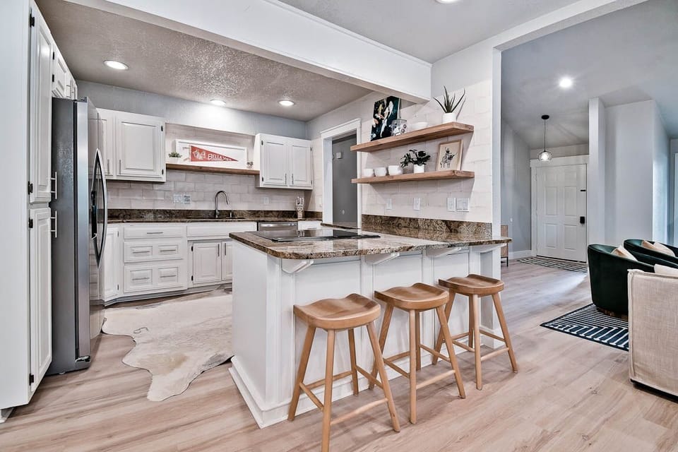 New appliances in the open kitchen with bar seating 