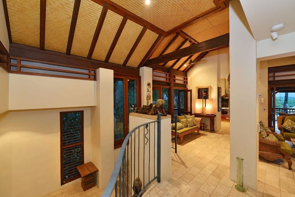 Living area and staircase leading to the first level of the property.