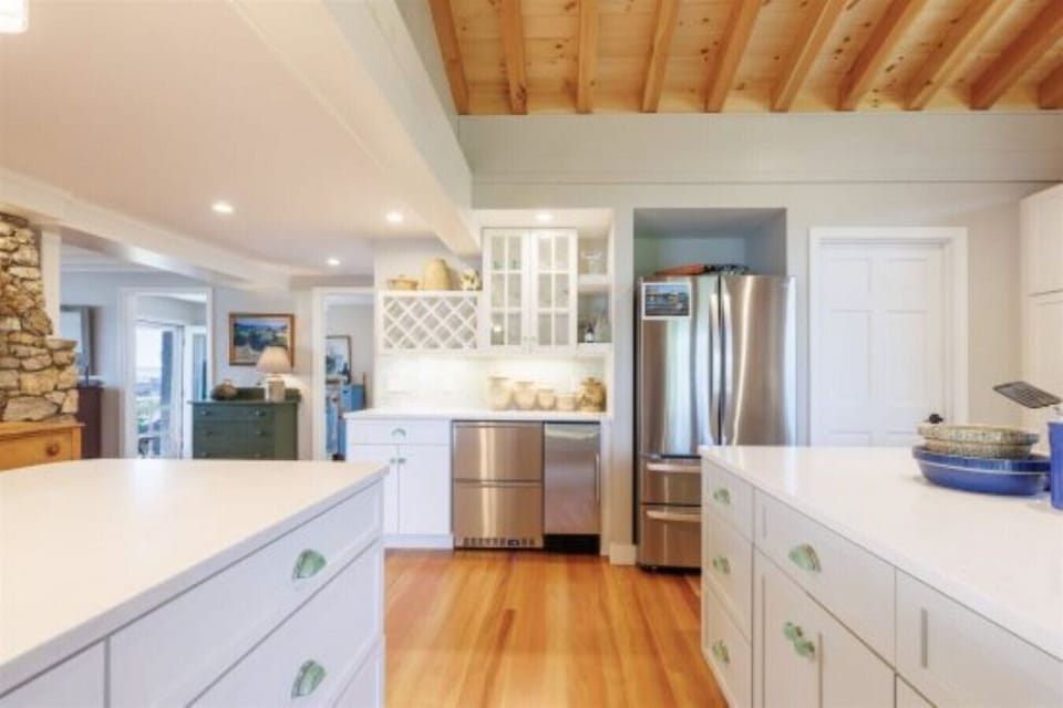 This kitchen offers an extra beverage refrigerator & an ice maker