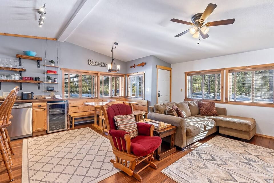 Welcome to a harmonious space where the comfort of the living room converges with the charm of a breakfast nook, creating a delightful setting for relaxation and dining.