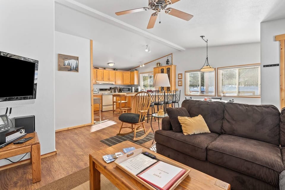 Unwind in the inviting living room, seamlessly connected to an open kitchen, creating a harmonious space for relaxation and culinary delights during your stay.