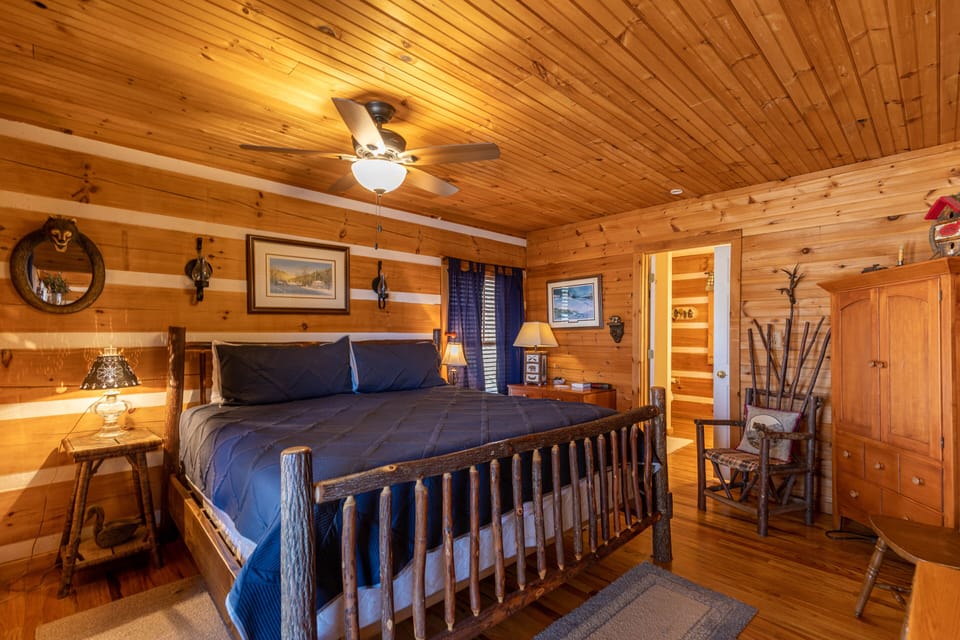 Sleep like you belong in the mountains. The rustic log bed and warm pine walls at Windsong set the tone for a true Blue Ridge getaway.