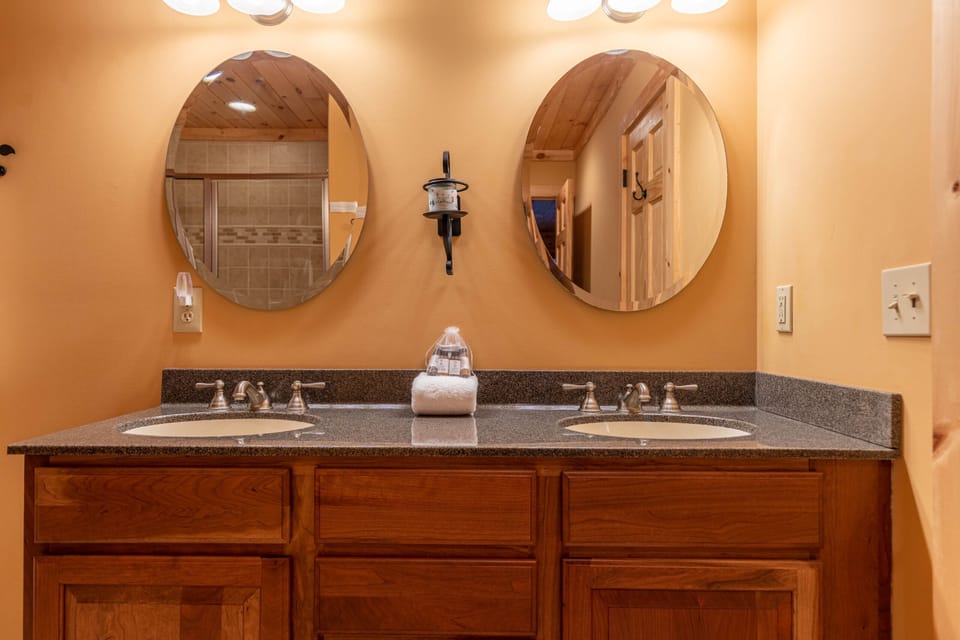 Plenty of room for everyone to get ready, with dual sinks and warm wood cabinetry.