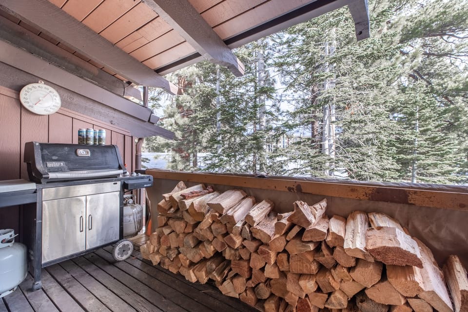Upstairs balcony equipped with gas grill and plenty of firewood for your stay.
