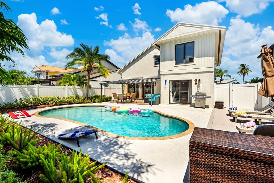 Your tropical backyard oasis awaits, sparkling heated pool & fun!