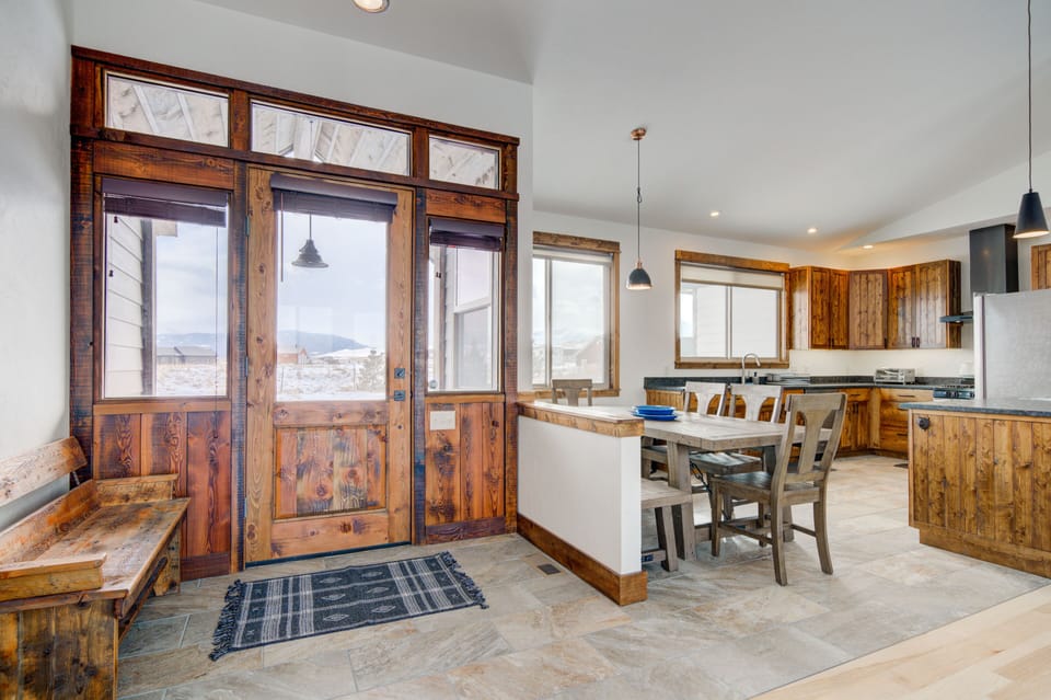 The home's main entry features custom reclaimed millwork and wood.