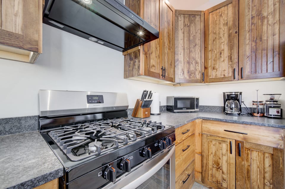 Fully-equipped kitchen with handcrafted, Shaker-style cabinets