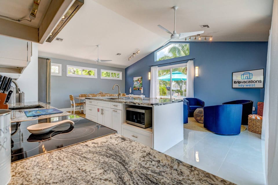 Easily transition from indoors to the outdoor dining area on the side of the yard at Bristol Keys.