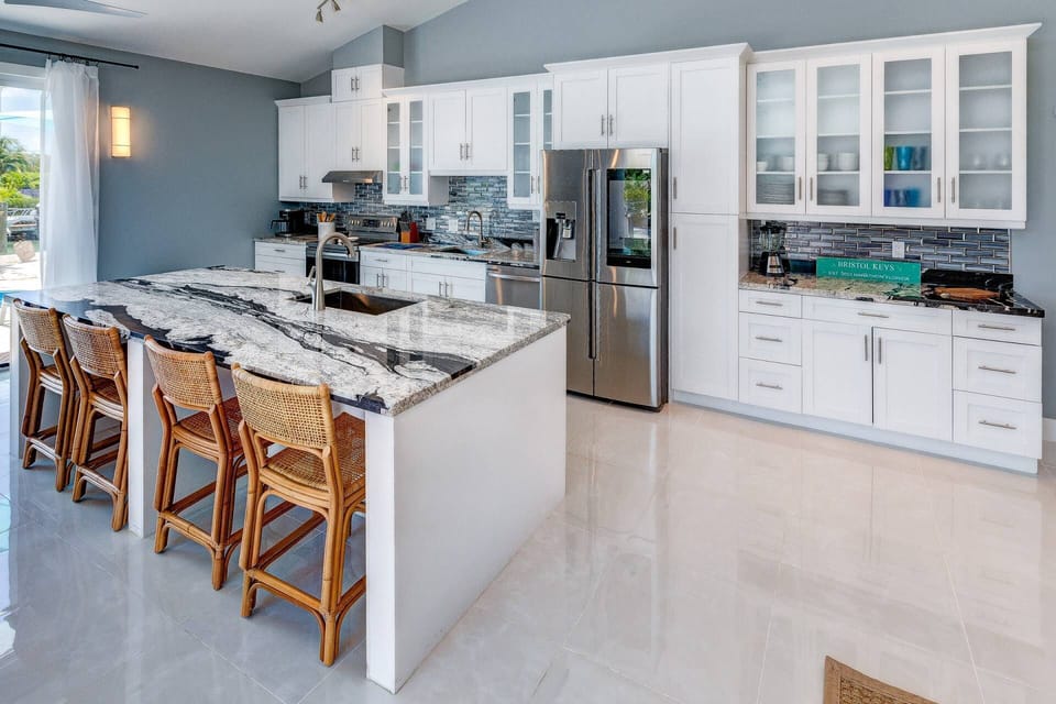 Enjoy conversations while preparing any meal with convenient seating at the kitchen island in Bristol Keys.