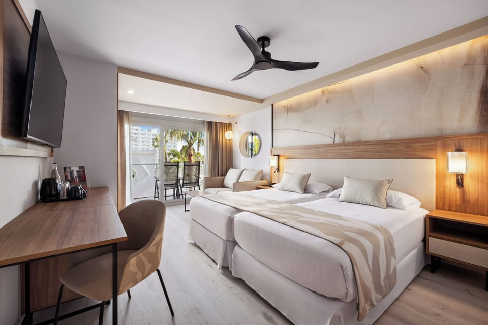 Double Room, Balcony, Partial Sea View | Minibar, in-room safe, free WiFi, bed sheets