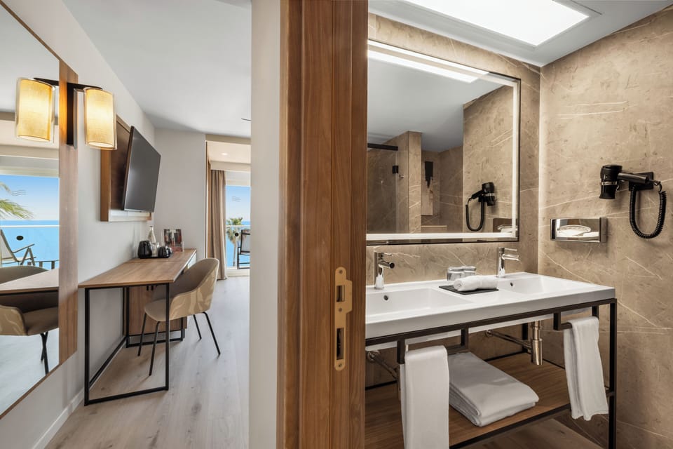 Standard Double Room, Balcony, Sea View | Minibar, in-room safe, free WiFi, bed sheets