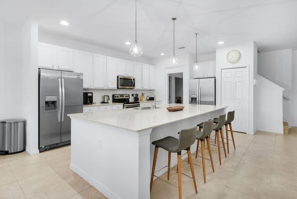 Fully stocked Chef's Kitchen with 2 refrigerator/freezers and 2 dish washers