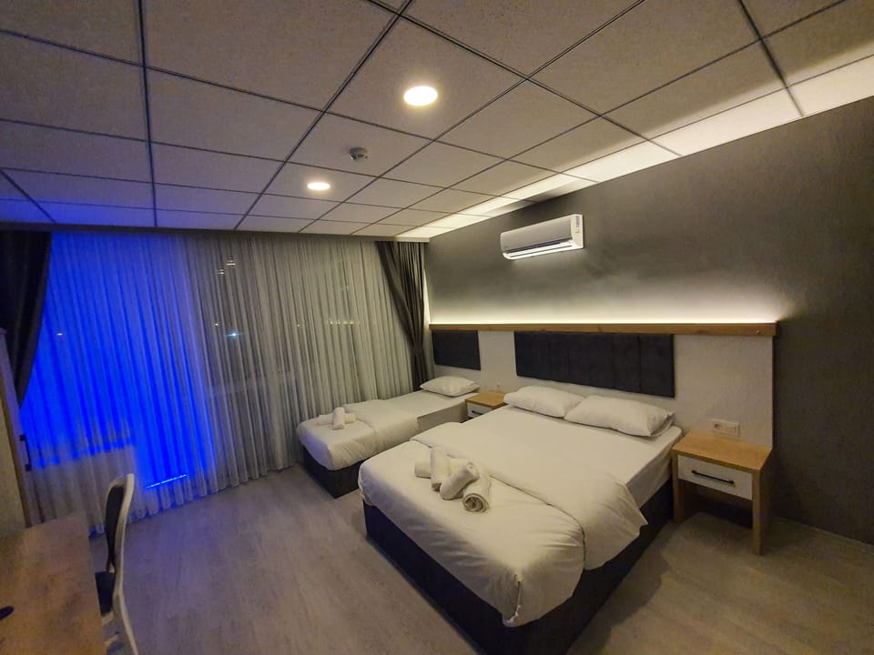 Family Triple Room | Premium bedding, minibar, free WiFi, bed sheets