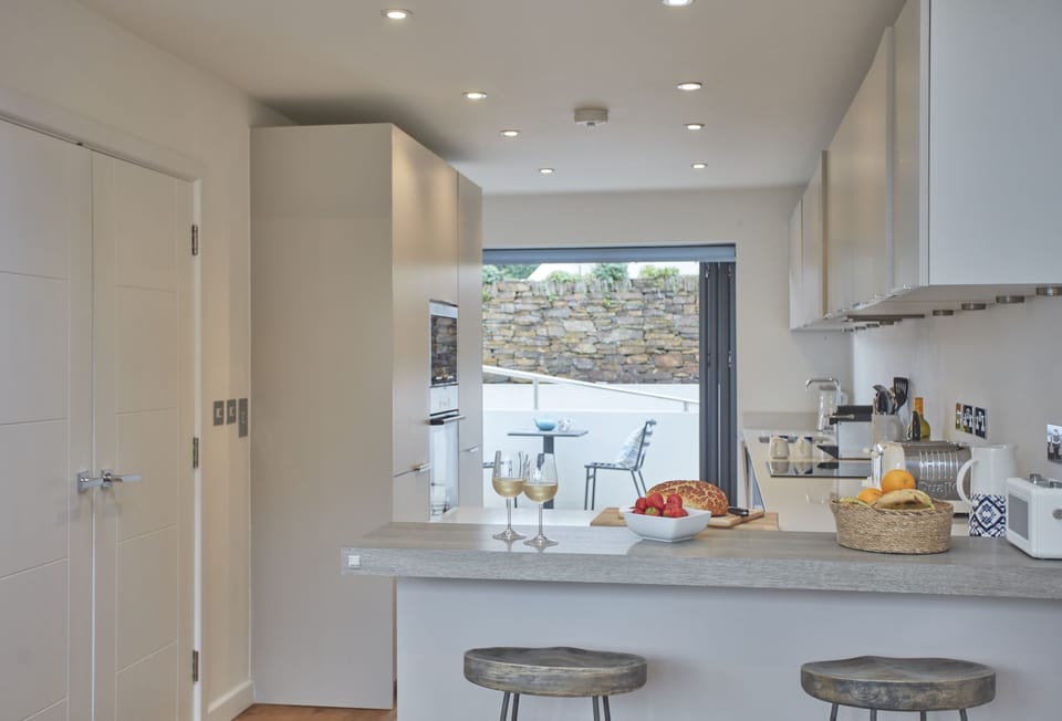 5 The Sands, Polzeath. Modern well-equipped kitchen opening up to the front of the property