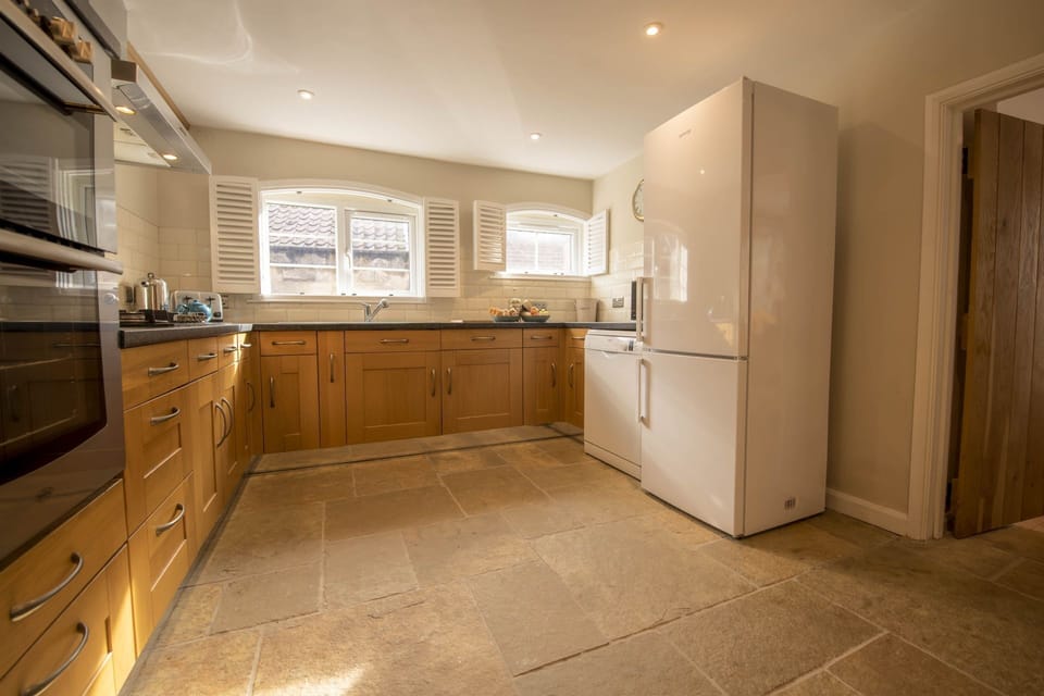 Ground floor: Light floods the well-equipped kitchen overlooking the patio area