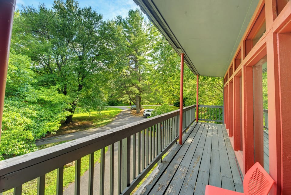Covered balcony with peaceful tree views and a relaxing outdoor retreat