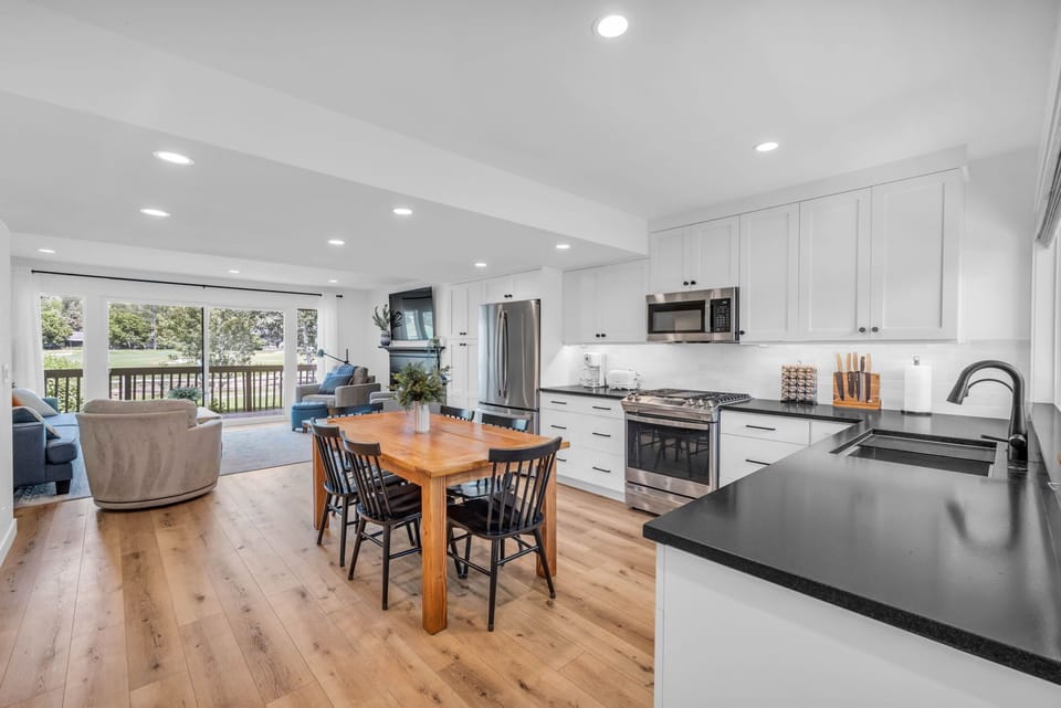 The home’s ground level has an open-concept floor plan placing the kitchen, dining, and living room all together creating a thoughtfully designed space for your group to enjoy.