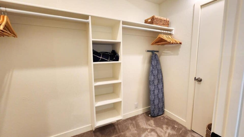 The master bedroom features a walk-in closet providing ample space for guests to unpack their personal belongings.