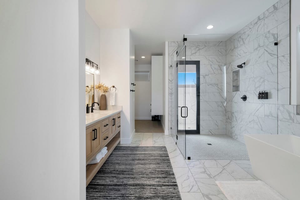 Main Shower - Have your choice of an indoor or outdoor shower. The large, walk-in shower in the main bathroom has a door opening up to a beautiful outdoor shower.