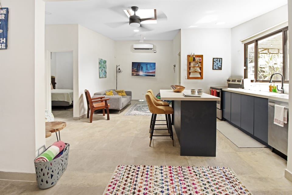Fully stocked kitchen with stove, dishwasher, microwave. Flatscreen TV in the lounge area