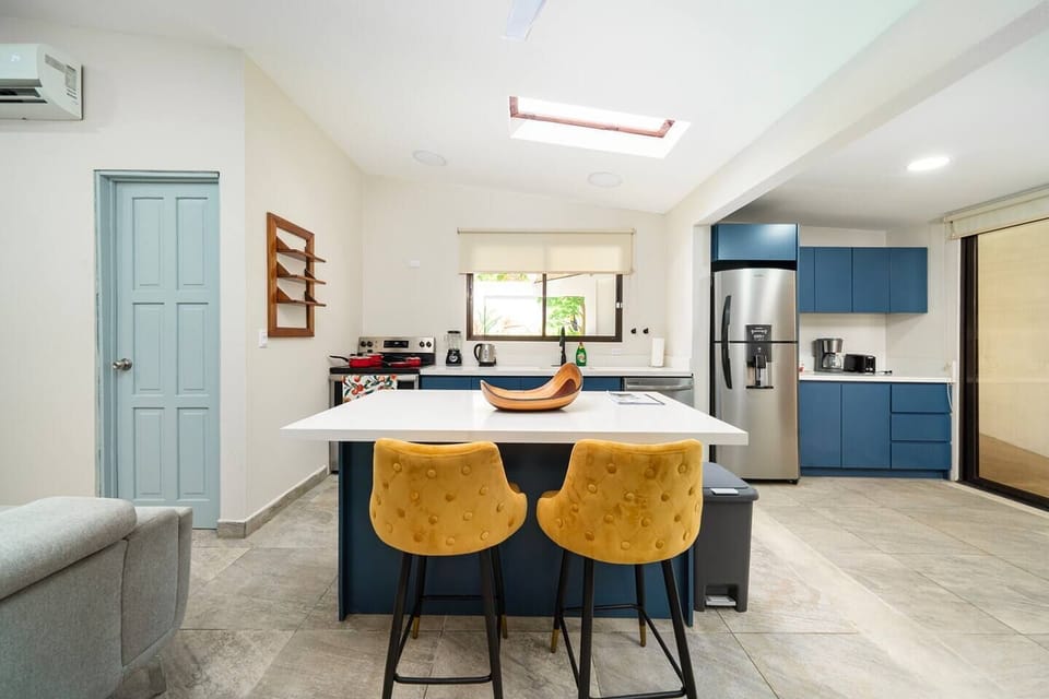The island is ideal for a quick breakfast or to keep the chef company while they cook. Plenty of storage for your food in the stainless steel fridge.