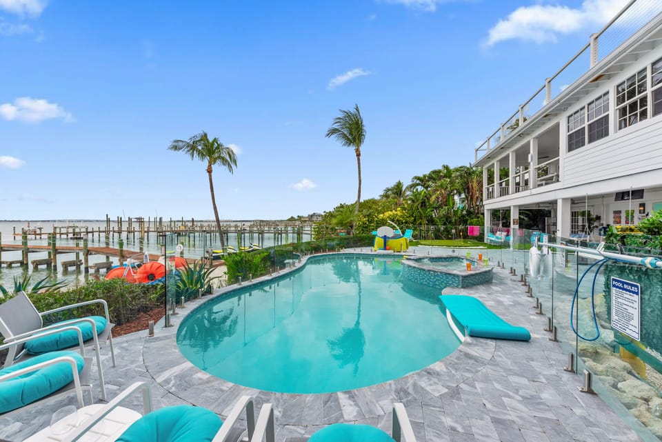 Aquarius South riverfront heated pool w/ glass fencing