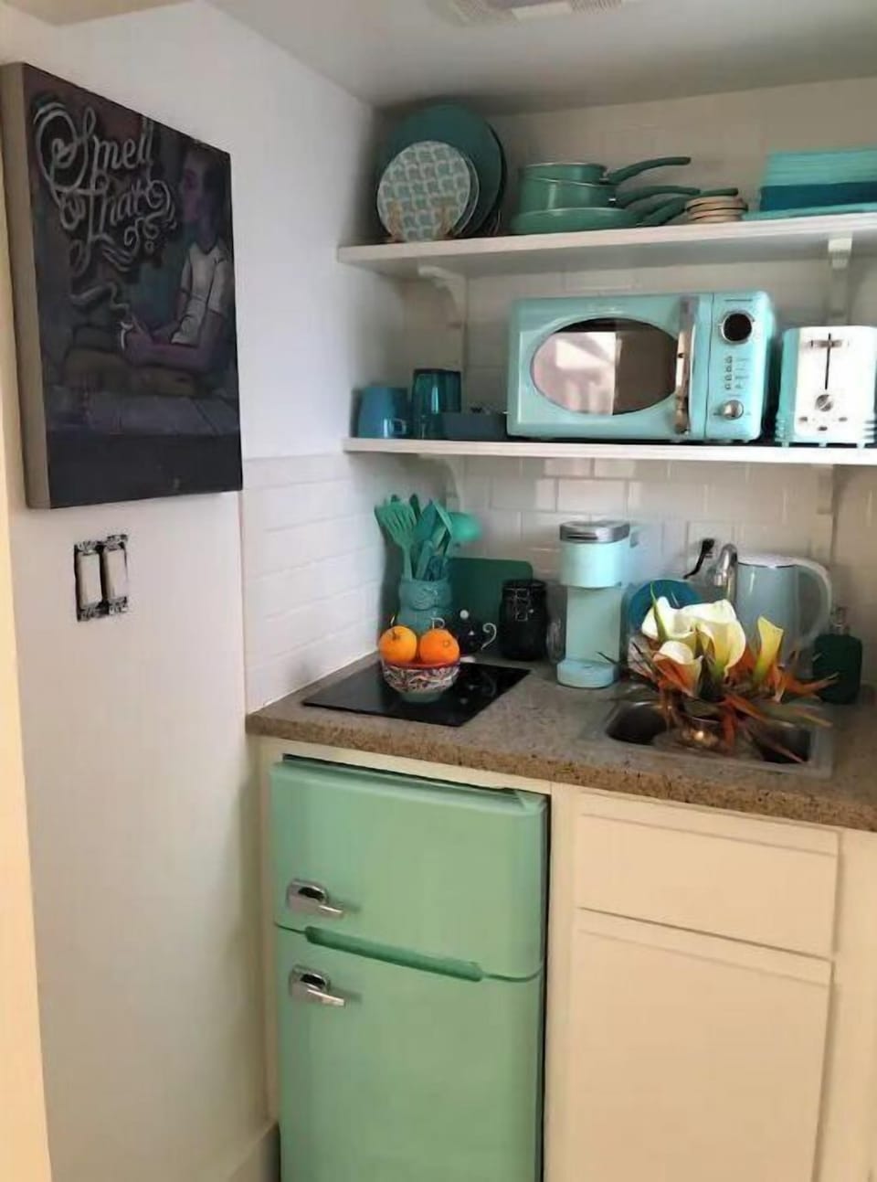 The fridge is counter-high so we can take better advantage of the limited space.