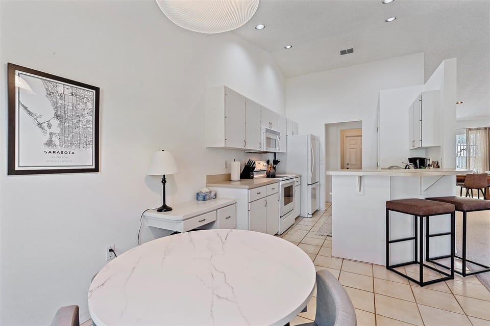 Breakfast nook flows seamlessly from the kitchen. Perfect for a cup of coffee or a good puzzle on a rainy day!