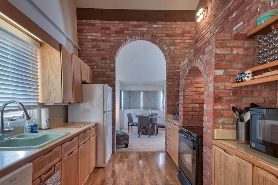 Kitchen with unique brick work throughout