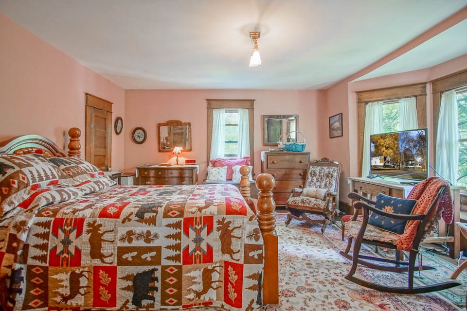 This is the master bedroom also known as The Rose Room with a private bathroom. This bedroom has a queen bed.