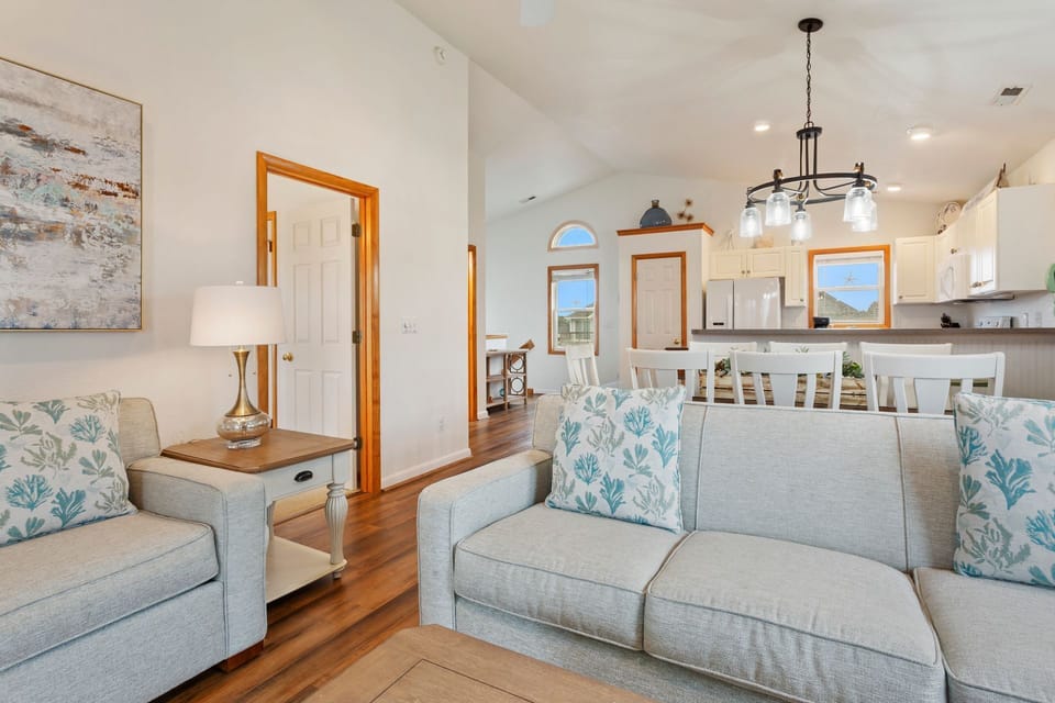 Relax in the spacious Living Area with beautiful lighting and high ceilings.