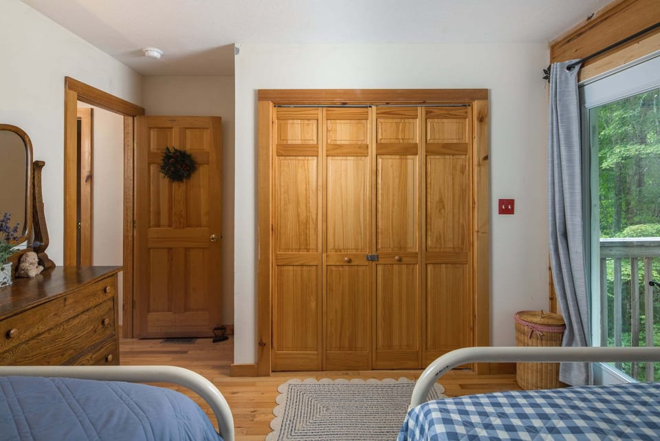 Bedroom with two Full beds and a spacious double-door closet