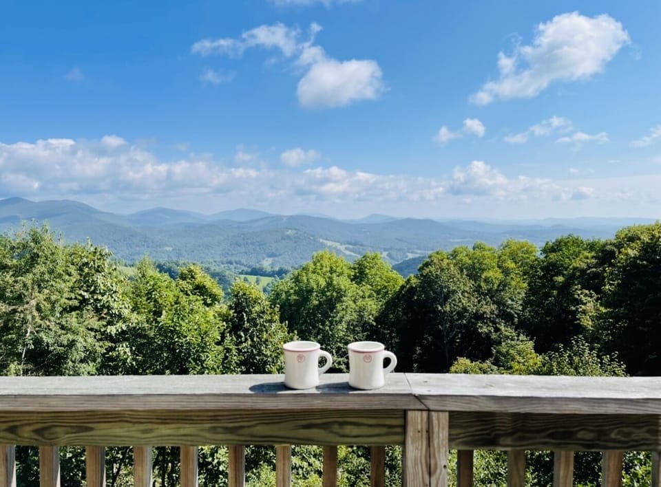 Enjoy morning coffee overlooking the sweeping Blue Ridge Mountain views