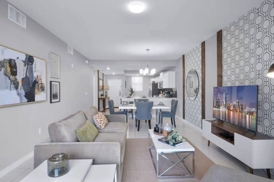Living Room with 55" Smart TV#Disney #Parks #kingdom #springs #StoreyLake #Apartment #Vacation #Rental #waterpark #Kissimmee #Orlando #universal #citywalk