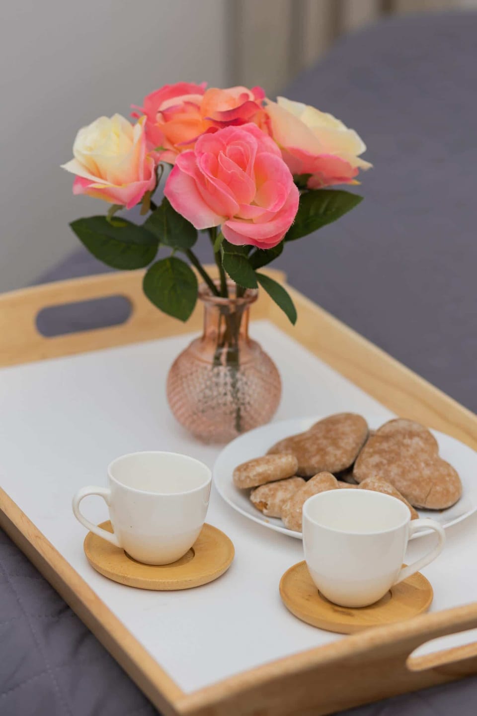 A dining table with seating for four, positioned near the living area, featuring minimalist styling and soft lighting.
