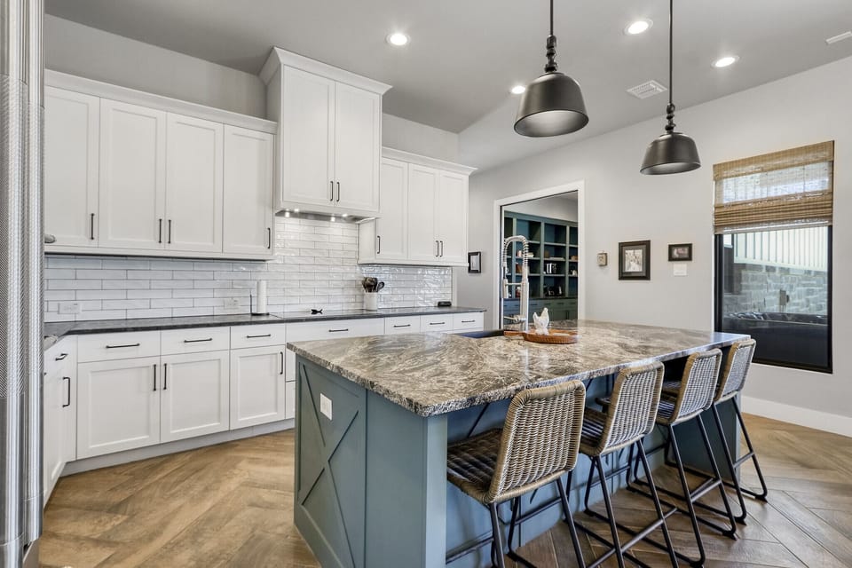 Walking back toward the kitchen from the dining room table.