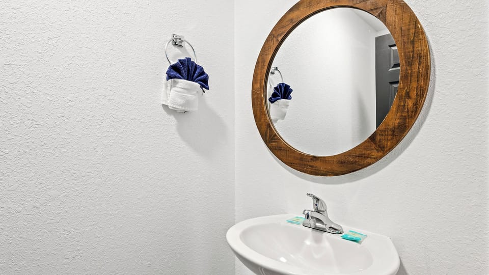 Enjoy the convenience of an additional half bathroom, perfect for guests needing a quick refresh.