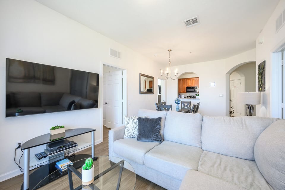 Living area with sectional, 65" Smart TV, 150+ channels (Spectrum cable)