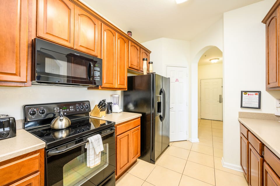 Kitchen with dishwasher, stove, micro, fridge w/ice & water, coffee maker, etc