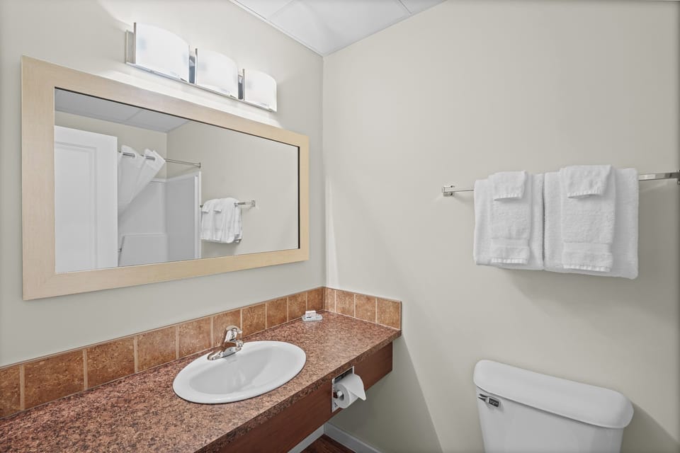 Combined shower/tub, hair dryer, towels, soap