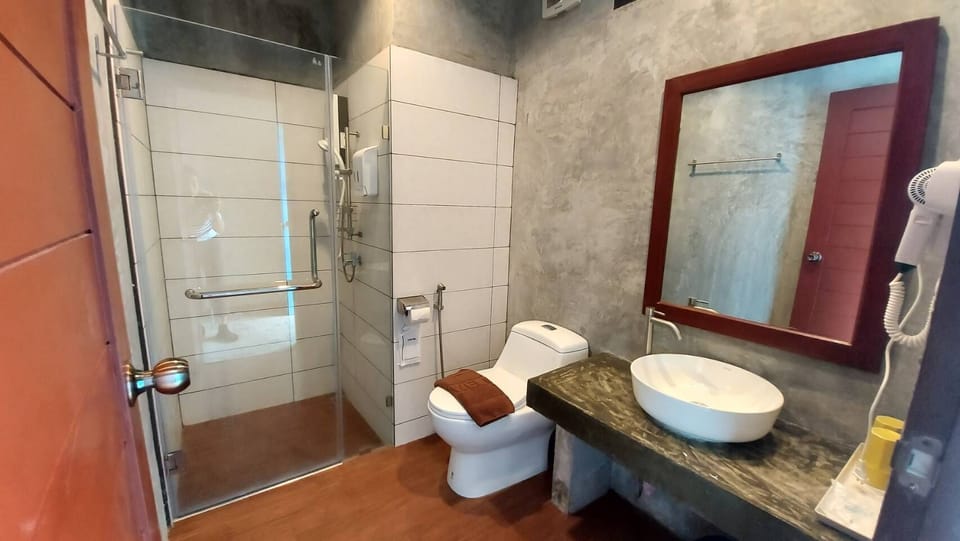 Shower, hair dryer, slippers, towels