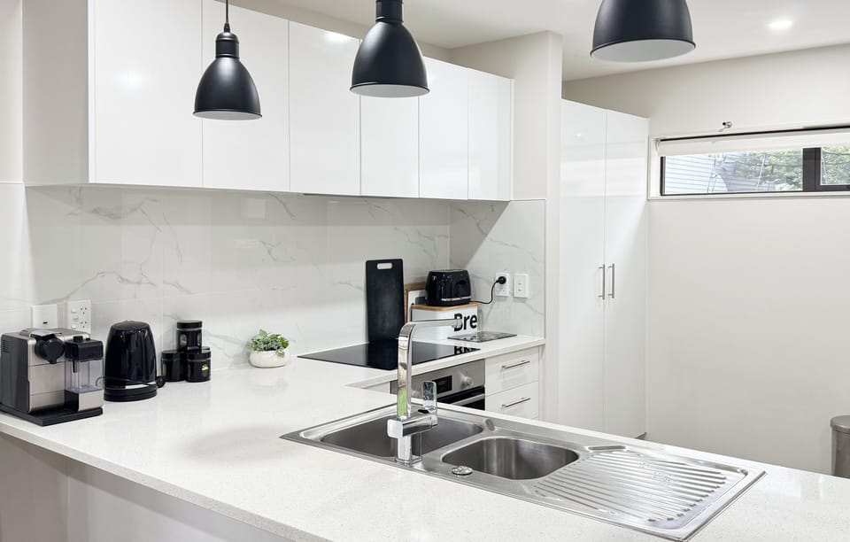 Fully equipped modern kitchen with generous bench space.