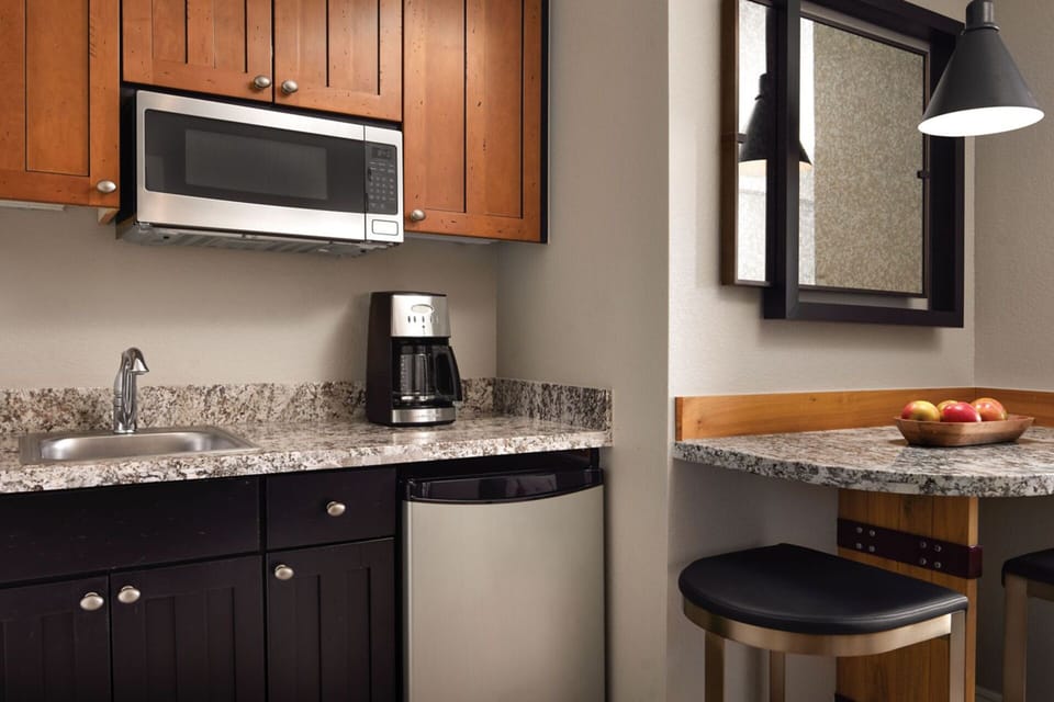 Guest room comes with a well appointed kitchenette and small dining table for 2