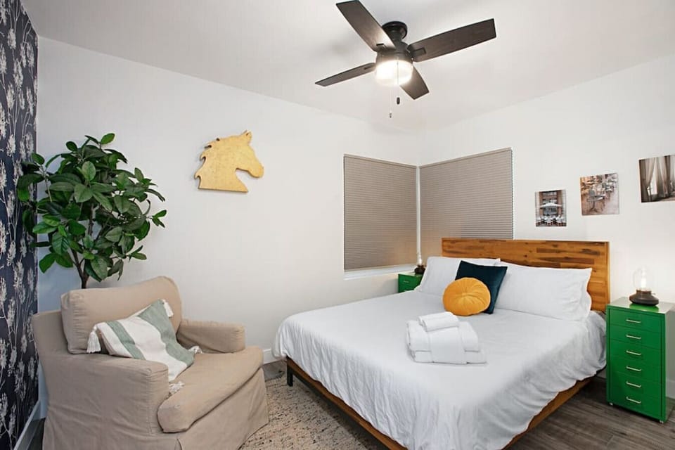 Bedroom with queen size bed  and cozy seating, perfect for reading and relaxing -Bedroom 3