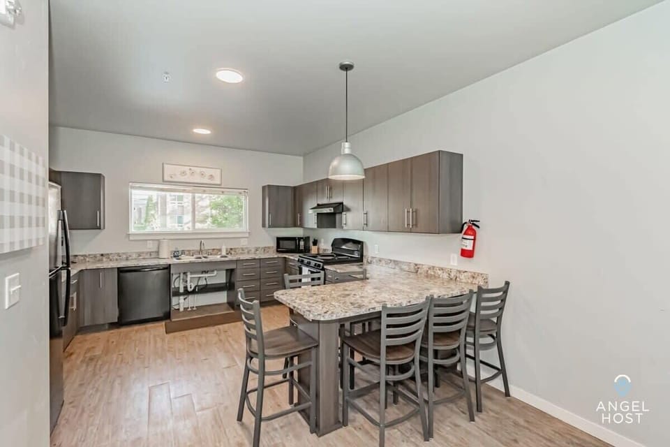 Spacious kitchen with modern appliances for preparing meals at home.